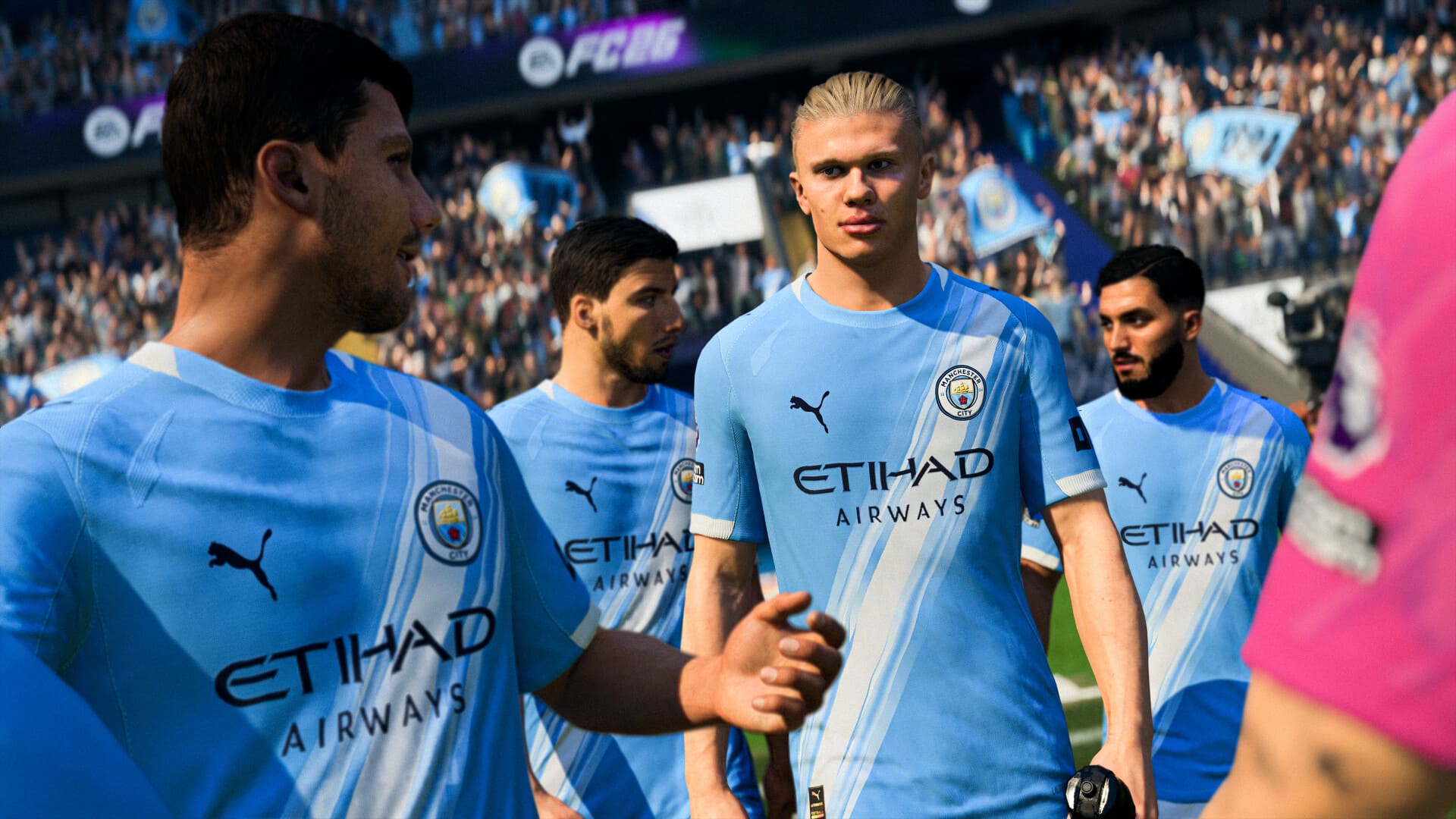 FC 26 in-game scene showing Manchester City players walking onto the pitch, featuring detailed player models in the team’s light-blue home kits during a match atmosphere.